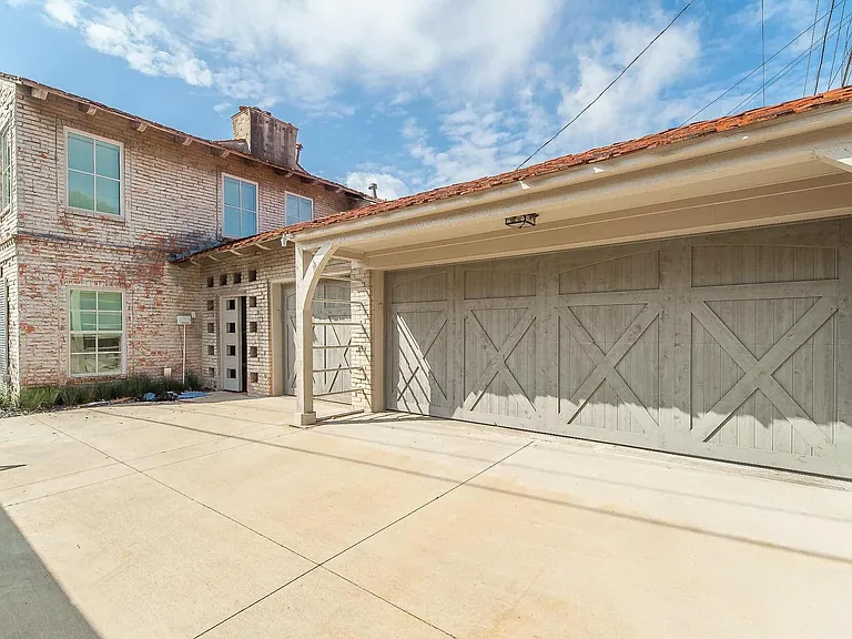 Gated back drive with two car garage