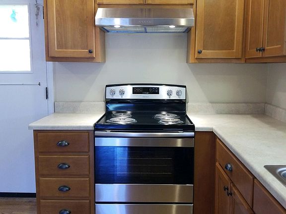 Kitchen - back door leads to back yard, carport, and partial basement