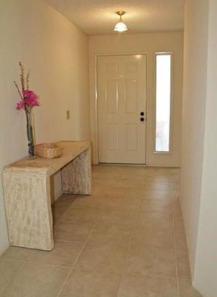Large foyer and tile flooring throughout.