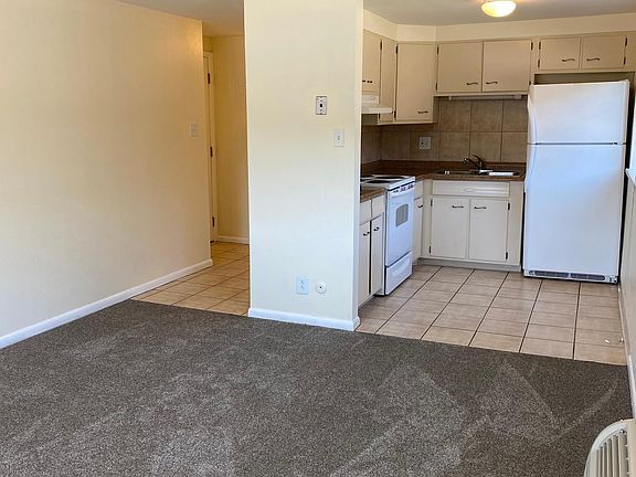 Unit has been freshly painted an off-white color and cleaned. Fridge and stove are immaculate!