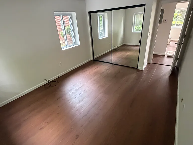 Bedroom with mirrored double door large closet