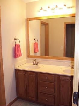 Full bathroom on the second level with double sinks.