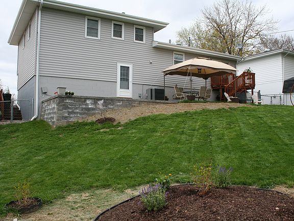 Huge fenced backyard with a new retaining wall and patio (2010); stunning view
