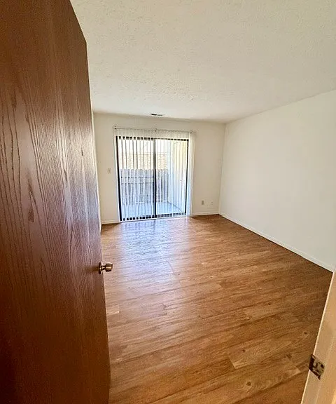 Second bedroom with sliding glass doors to patio