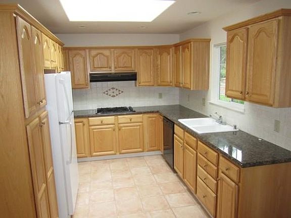 Kitchen with granite counter tops.
