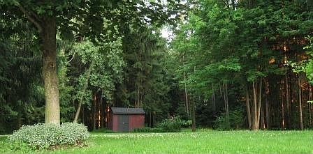 Upper back lawn includes approx 1 acre of woods behind shed
