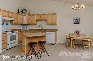 Kitchen w/Breakfast Bar & Dining Area