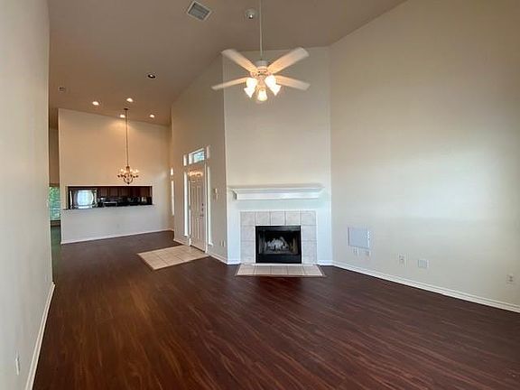 Wood burning fireplace with shelving above for decor.