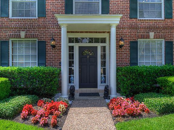 Professional landscaping draws you into the home