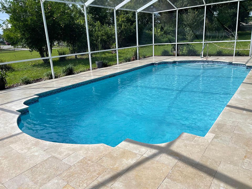 beautiful pool and travertine deck