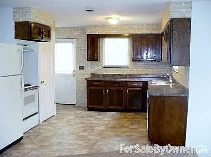 Kitchen includes appliances
						:
						Freshly stained cabinets.