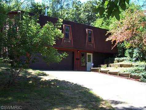 This home has a style of its own, Hidden in the city of Greenville, with 3 spacious bedrooms and 2 baths with the  master bedroom and bath having a tiled jetted tub. A family room, plus a living area. There are vaulted ceilings through-out. there is an extra room upstairs that could be finished off, it has a lot of light, it is used for storage right now. A screened in porch the full width of the house. A work shop ,laundry room, large 2 car garage, with cemented drive-way Plus 3 hidden rooms in the lower level, all dry walled and ready for use. A must see home