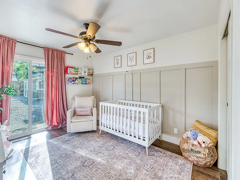 Large bedroom with slider access to the backyard.