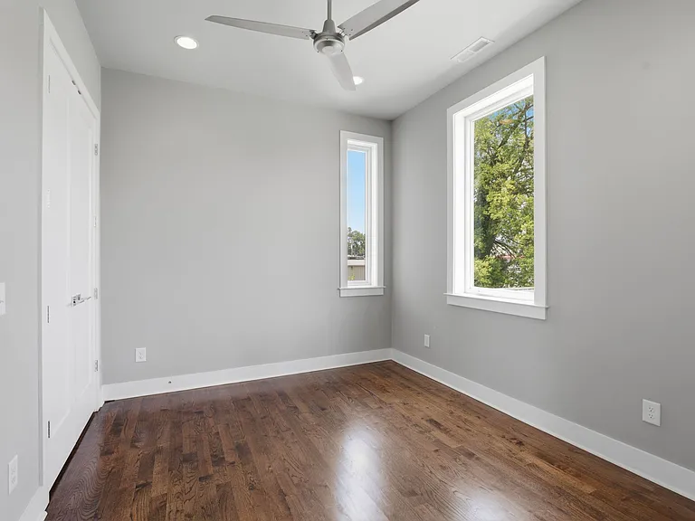 2nd guest bedroom features large windows, double closet doors and door leading into the jack and jill bathroom