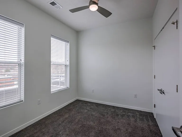 Bedroom with carpet in a unit at The Rise.