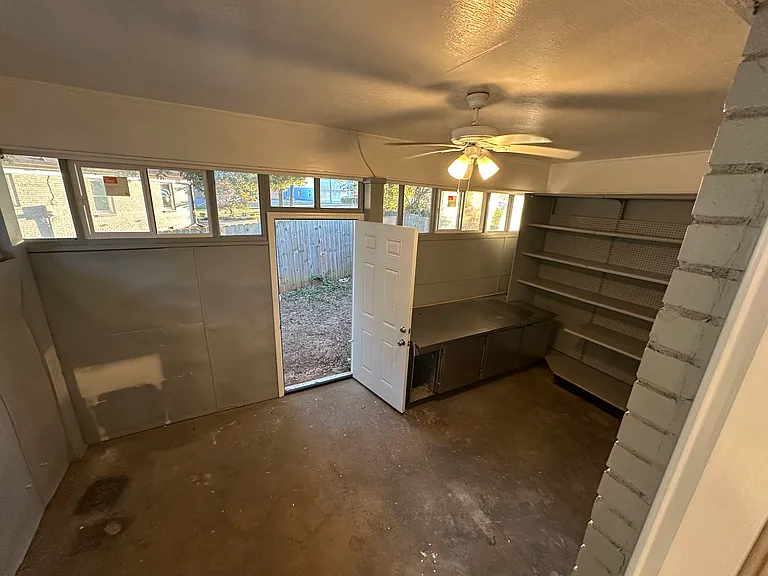 Garage converted to an additional storage pr living space. New windows and door to backyard via the right side of the house