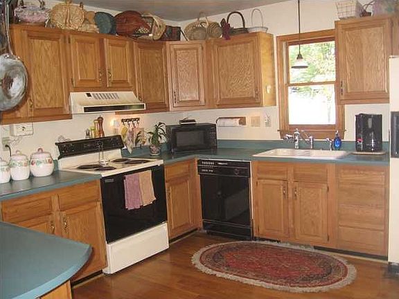 Roomy kitchen with tons of cabinet space and breakfast nook.