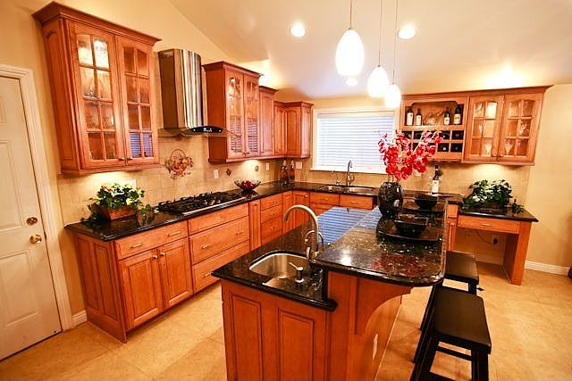Remodeled kitchen with granite countertops.