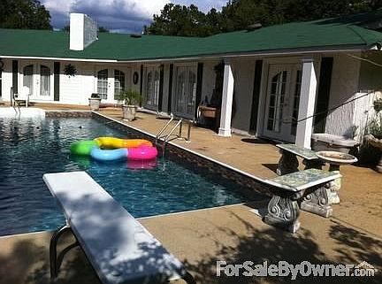 With-out the fence around the pool.