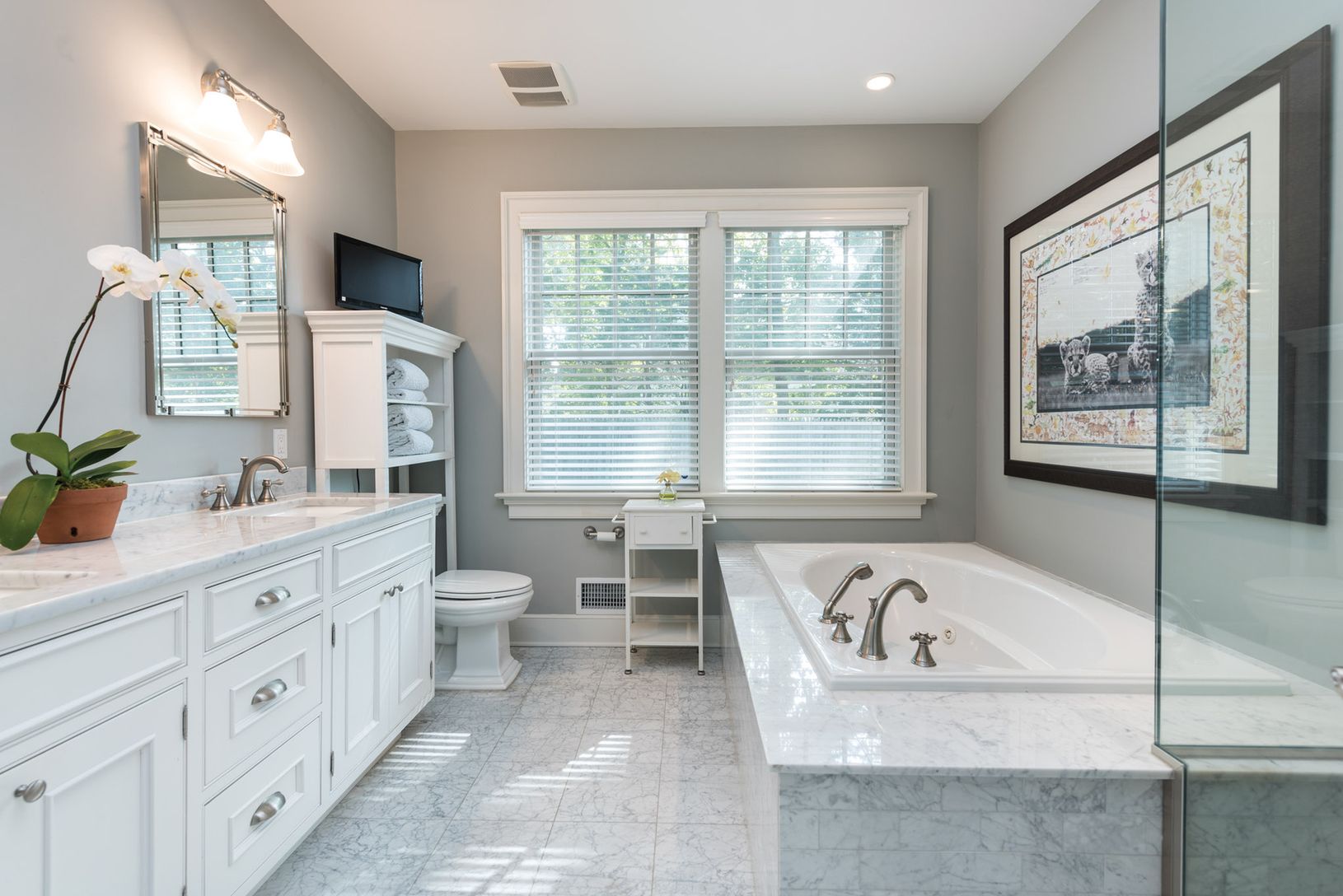  Glass enclosed large marble tiled shower