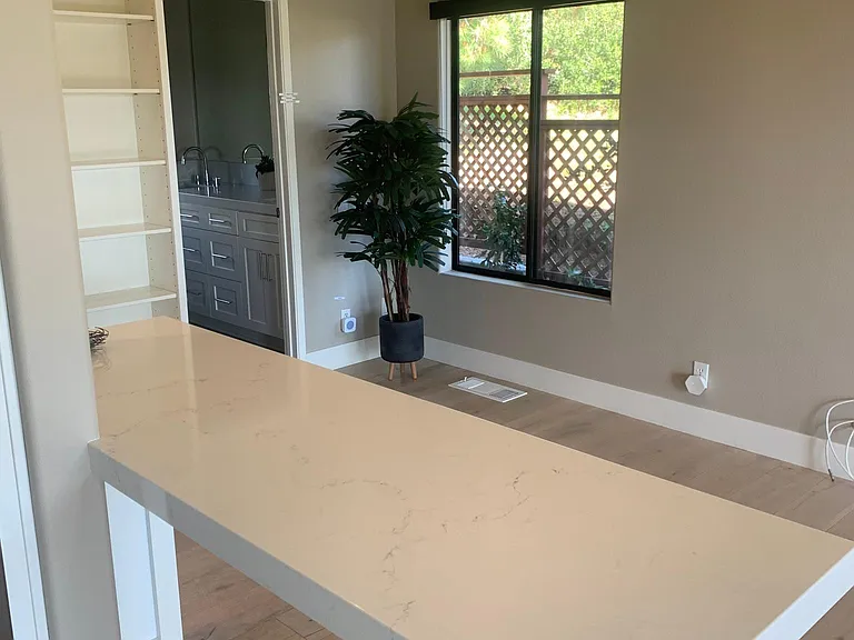 Built in table with extensive outlets for computer, printer etc_or use as a breakfast bar.