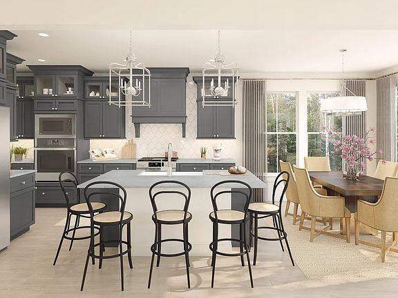 Kitchen with island, pendant lighting and glass-front upper cabinets