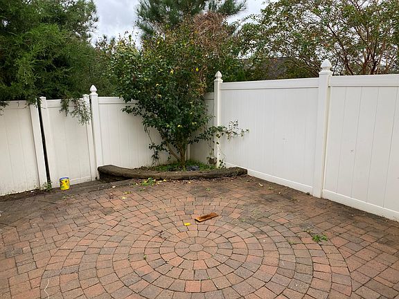 Bricked Courtyard with Privacy Fence