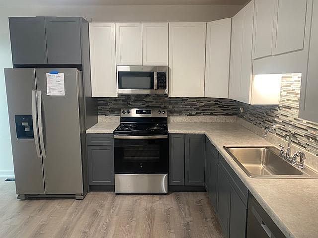 Large new EAT IN kitchen with brand new stove, refrigerator and dishwasher