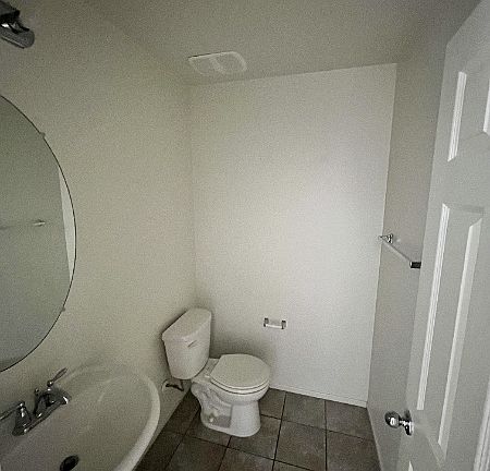 Powder bath for guests off of foyer