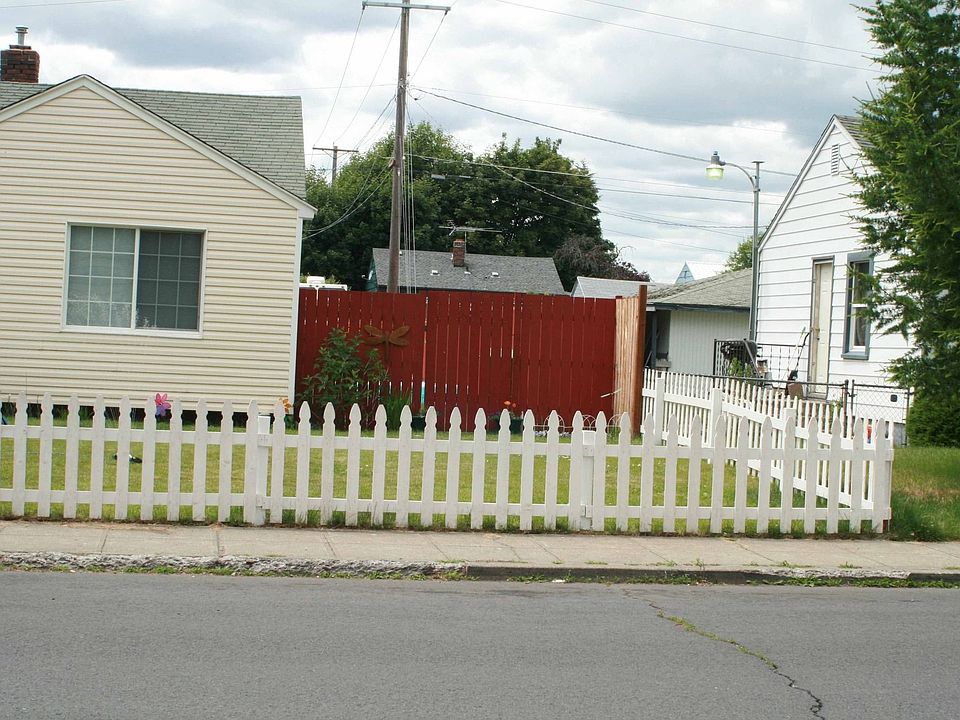 North Side of home with back fencing seen