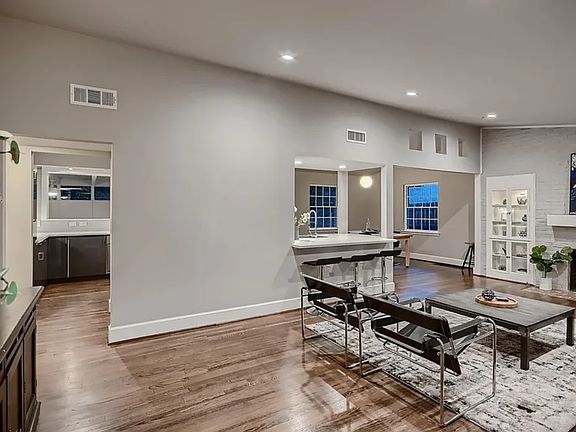 Main living area with open concept to eating area and kitchen.