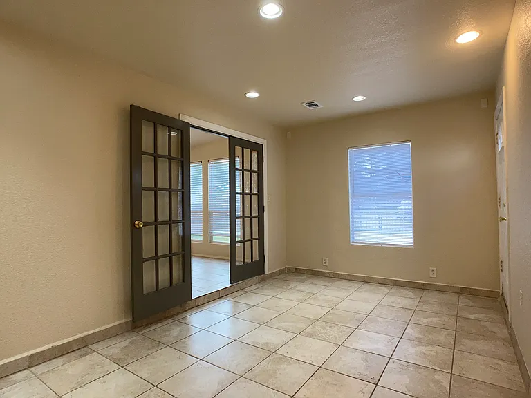 Extra room off living area. Can be second living area, office or 3rd bedroom. Doors on left to main living area