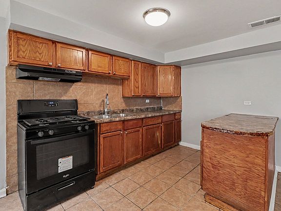5th image of 11540 S Peoria St #Sfr
