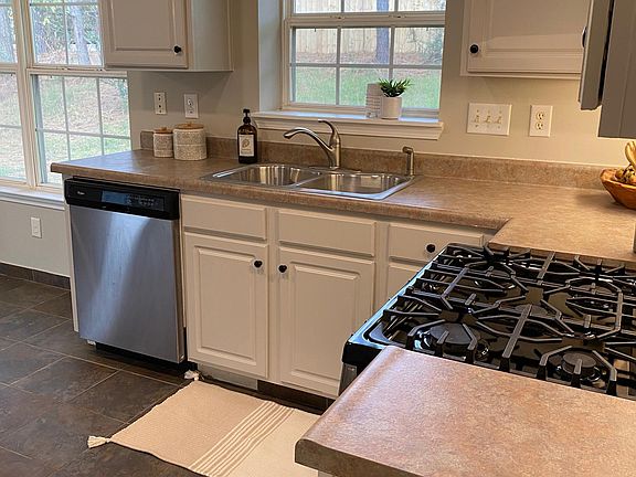 Kitchen with view of large fenced in yard!
