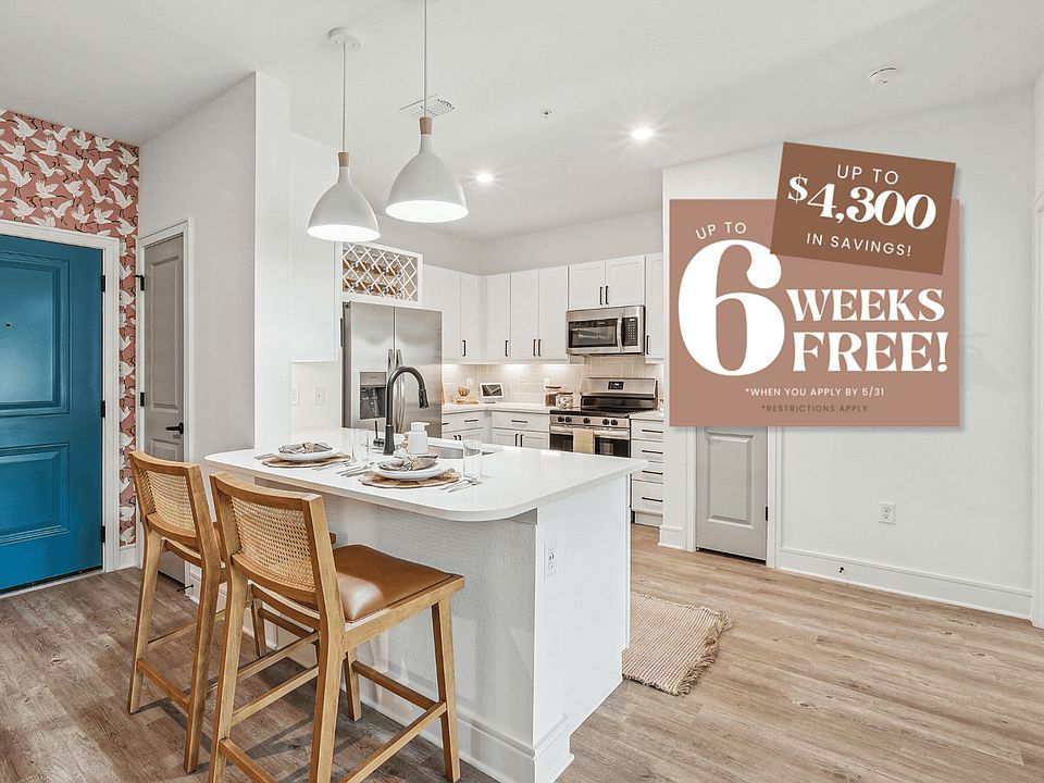 Kitchen with Quartz Countertop and Stainless Steel Appliances.