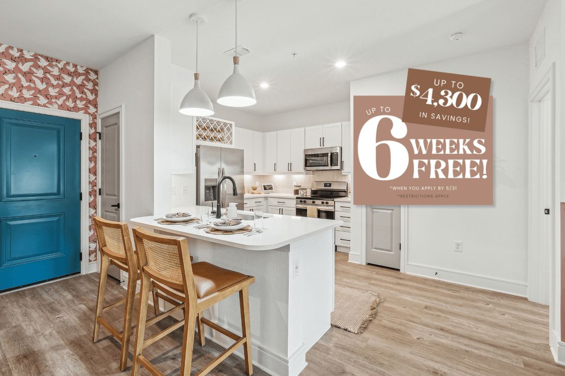 Kitchen with Quartz Countertop and Stainless Steel Appliances.