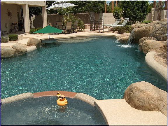 Inviting Heated Pebble-Tec Pool & Raised Therapeutic Spa