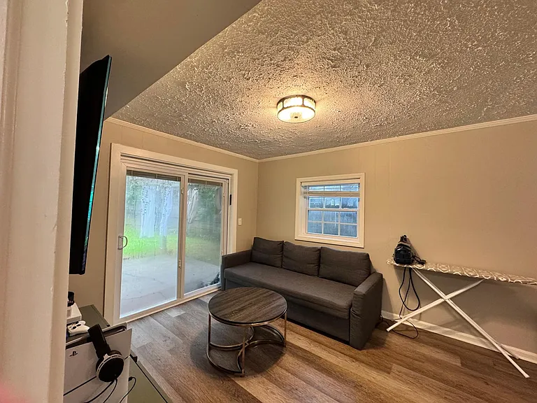 Bonus room o lower level that has patio access to pergola/sukkah