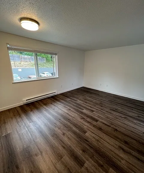 Apt #34, Gorgeous Wood
Plank Flooring, Cordless Faux Wood Blinds