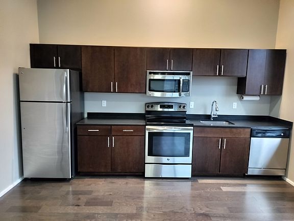 Honed granite countertops with stainless steele appliances