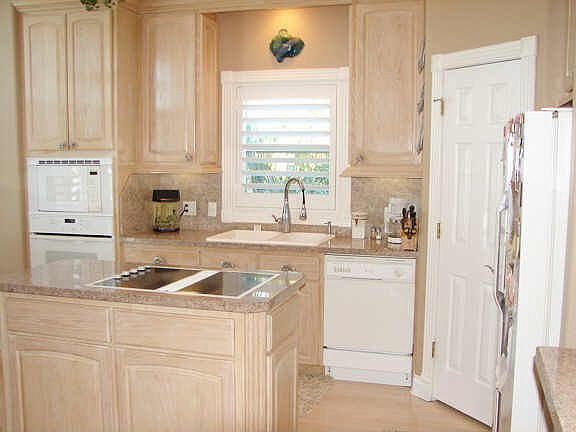 Island kitchen, granite counter tops and wood floors