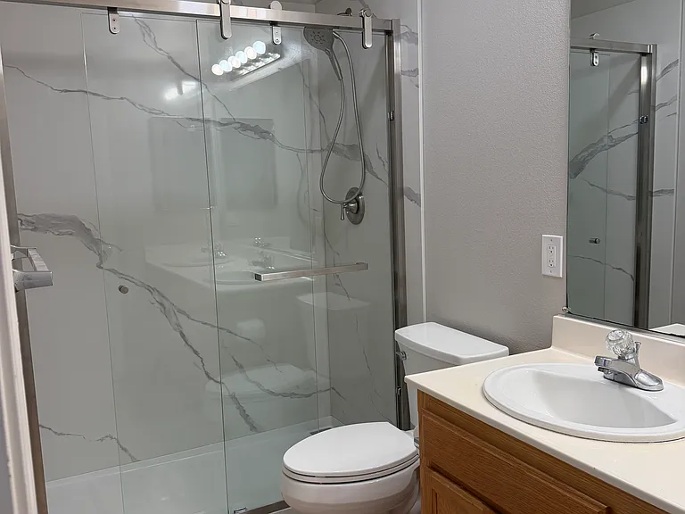 2nd bathroom walk-in shower with dual sink