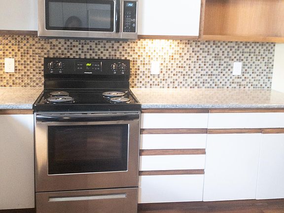 Kitchen with new range and microwave oven