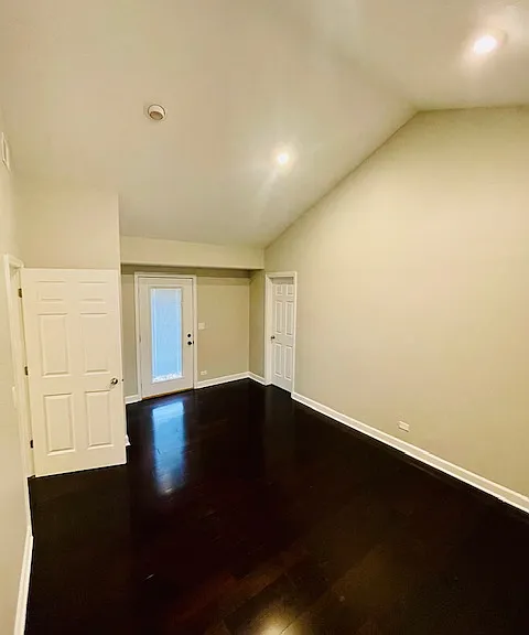 Primary bedroom has vaulted ceilings and walk-in closet