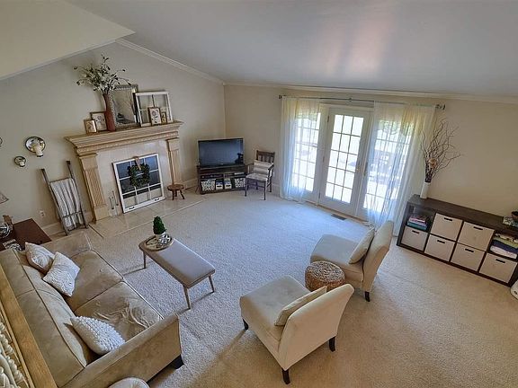 Glass french doors offer natural light and easy access to enjoy the backyard