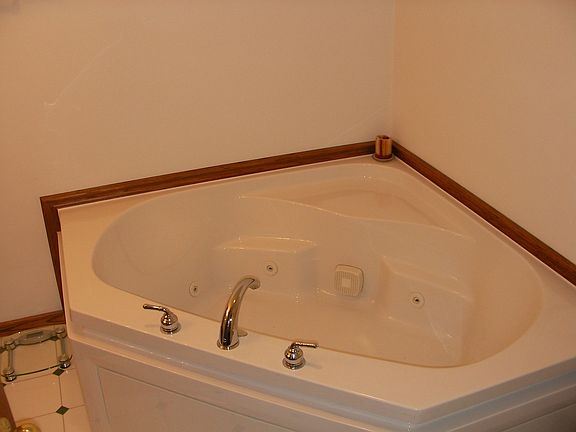 Full Master Bath with standup Shower and Corner Whirlpool Tub.