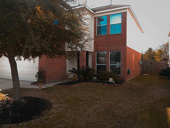 Covered front porch and beautiful landscaping.