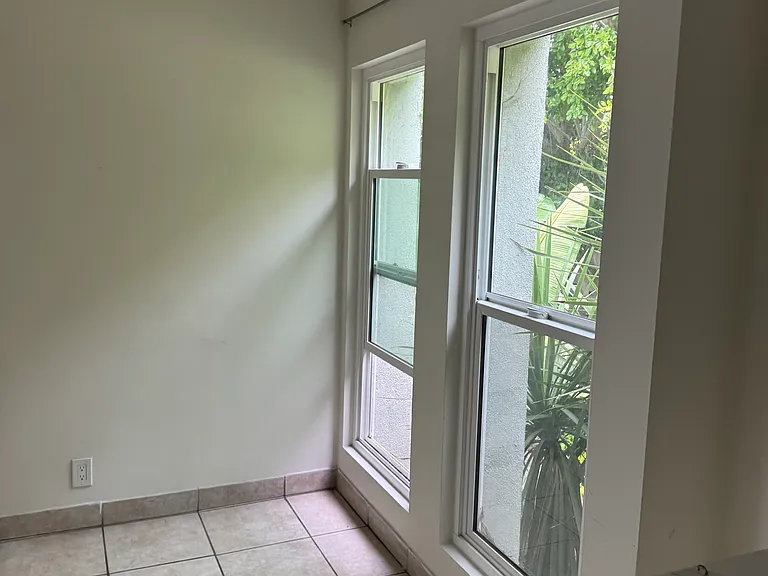 Large window bring in light to the dining room area.