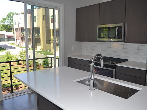 Light and airy kitchen that looks onto private courtyard & parking