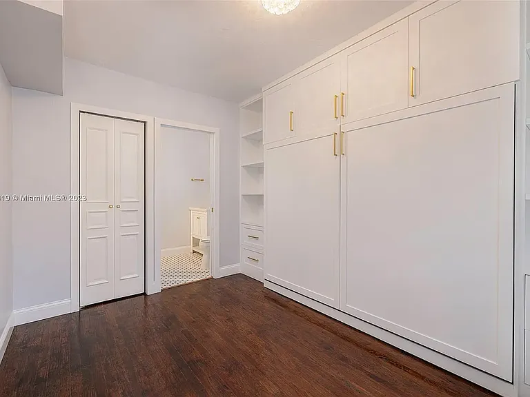 This bedroom includes a Murphy bed